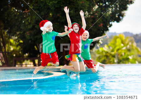 Christmas vacation on tropical island. Xmas kids. 108354671