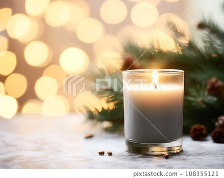 Holiday candle commercial, front view of burning candle in glass jar mock-up on Christmas background with winter decorations and bokeh 108355121