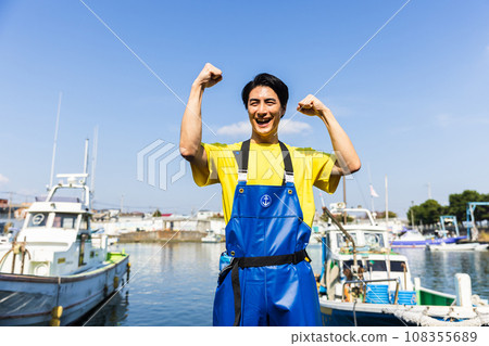 Young fishermen standing at the fishing port Young fishermen standing at the fishing port 108355689