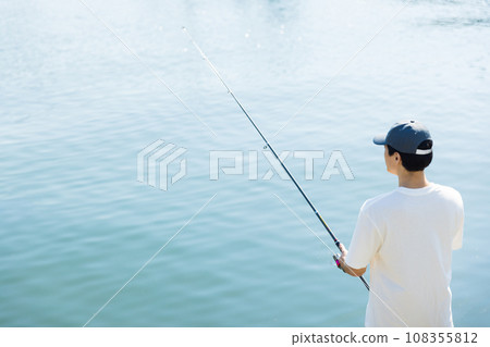 A man enjoying his hobby of fishing 108355812