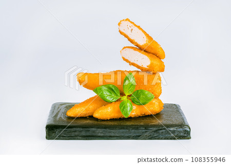 Breaded Chicken Inner Fillet, Chicken Breaded Raw Meat.Breaded Chicken nuggets Fillet with salad on a White Background,food at home. Fast homemade food.Chicken breaded schnitzels. Fast cooking. Breaded Chicken Inner Fillet, Chicken Breaded Raw Meat.Breaded Chicken nuggets Fillet with salad on a White Background,food at home. Fast homemade food.Chicken breaded schnitzels. Fast cooking. 108355946