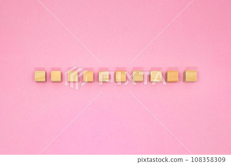 Front view of pink background with ten wood cubes in a row Front view of pink background with ten wood cubes in a row 108358309