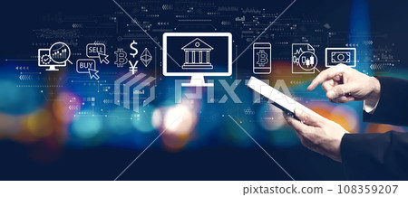 Cryptocurrency fintech theme with businessman using a tablet computer 108359207