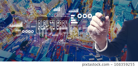 Play to Earn theme with businessman in city at night 108359255