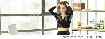 Worried brunette woman puts hands on head feeling nervous Worried brunette woman puts hands on head feeling nervous 108361781