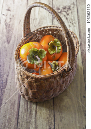 Many freshly picked persimmons Many freshly picked persimmons 108362380