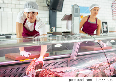 Guy seller works in specialized butcher shop Guy seller works in specialized butcher shop 108362950