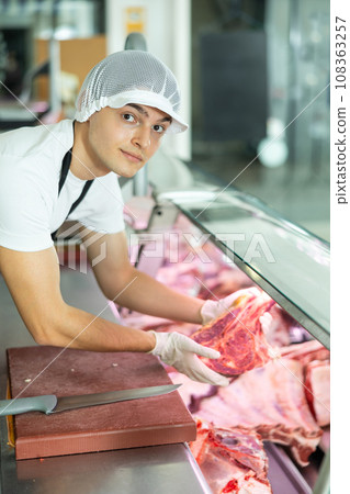 butcher skillfully working butcher skillfully working 108363257