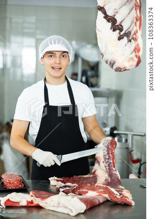 man behind counter prepares man behind counter prepares 108363374