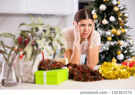 upset girl in a festive New Year s atmosphere upset girl in a festive New Year s atmosphere 108363574