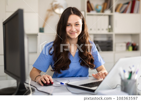 Portrait of doctor who is working with laptop 108363597