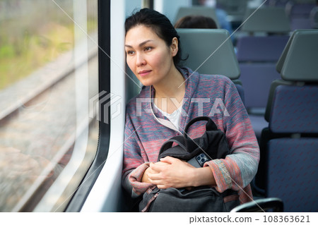 Portrait of woman traveling in urban trai Portrait of woman traveling in urban trai 108363621
