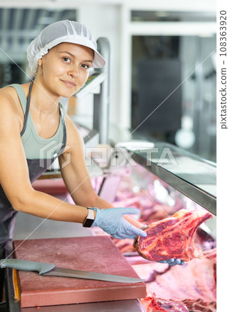 woman behind counter showcases woman behind counter showcases 108363920