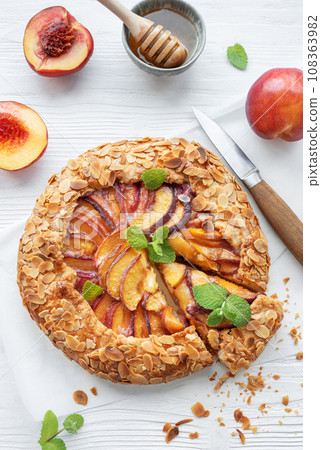 Homemade galette with peaches. Homemade galette with peaches. 108363982