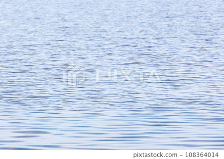 Light blue sea water surface with ripple pattern, natural background Light blue sea water surface with ripple pattern, natural background 108364014