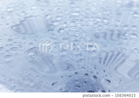 Water drops are on shiny steel plate, macro photo Water drops are on shiny steel plate, macro photo 108364015