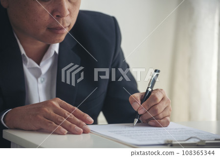 Asian business man using pen signing on new contract to starting projects in conference room. Close up manager businessman hands sign contract working meeting. Business agreement concepts. 108365344