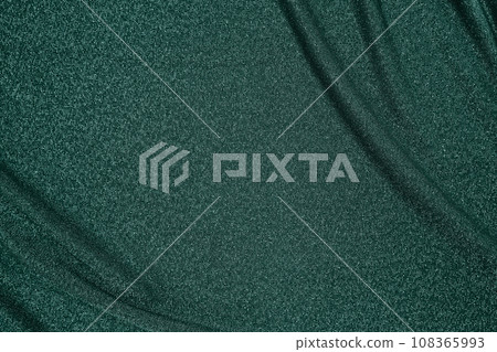 Background of draped dark green fabric with silver lurex thread Background of draped dark green fabric with silver lurex thread 108365993