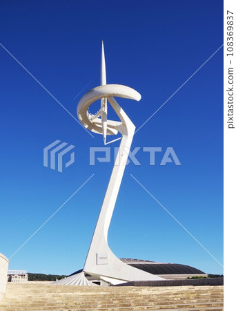 Montjuic tower shining against the blue sky Montjuic tower shining against the blue sky 108369837