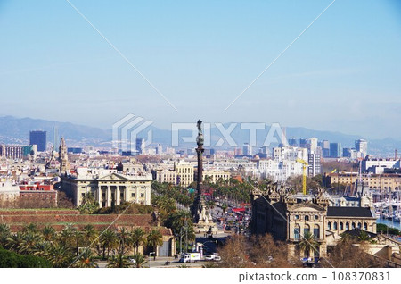 Columbus Monument towering over the city of Barcelona 108370831