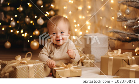 Happy little one with a child with Down syndrome with gifts and lights on the background Happy little one with a child with Down syndrome with gifts and lights on the background 108370871