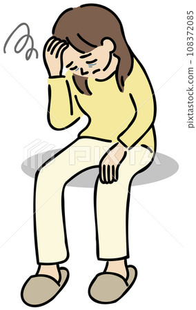 A woman sitting down with her hand on her forehead 108372085