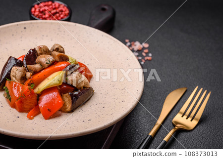 Delicious salad of grilled vegetables tomatoes, mushrooms, sweet peppers, eggplants 108373013