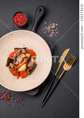 Delicious salad of grilled vegetables tomatoes, mushrooms, sweet peppers, eggplants 108373016