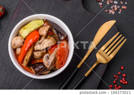 Delicious salad of grilled vegetables tomatoes, mushrooms, sweet peppers, eggplants Delicious salad of grilled vegetables tomatoes, mushrooms, sweet peppers, eggplants 108373021
