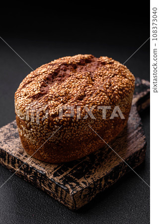Delicious fresh crispy brown bread with seeds and grains 108373040