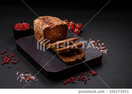 Delicious fresh crispy brown bread with seeds and grains 108373051