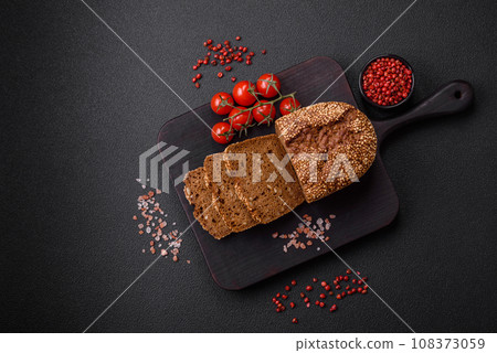 Delicious fresh crispy brown bread with seeds and grains 108373059