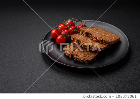 Delicious fresh crispy brown bread with seeds and grains Delicious fresh crispy brown bread with seeds and grains 108373061