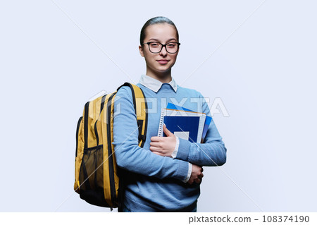 Portrait of teenage girl high school student on white background 108374190
