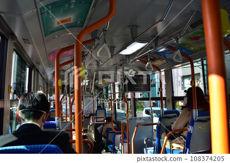 Kyoto in spring, Japan. Passengers wearing masks riding a local bus near Kiyomizu Temple. Kyoto in spring, Japan. Passengers wearing masks riding a local bus near Kiyomizu Temple. 108374205