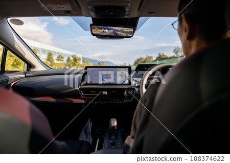 Driver's seat of a car traveling on a highway 108374622