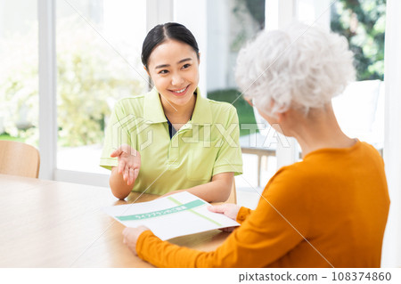 Care manager explaining to senior woman Care manager explaining to senior woman 108374860