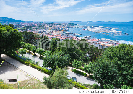 The view from the hill in Parque Monte del Castro, park located on a hill in Vigo, the biggest city in Galicia Region, in the North of Spain. View of the sea, harbour and docks, selective focus 108375954