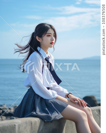 High school girl sitting on the beach High school girl sitting on the beach 108376508