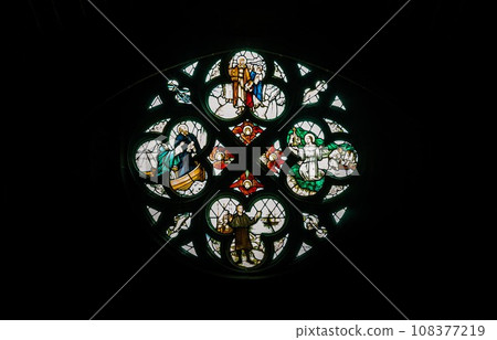 Silhouette of Stained glass window, Pattern of Medieval gothic rose window in Liverpool cathedral. Silhouette of Stained glass window, Pattern of Medieval gothic rose window in Liverpool cathedral. 108377219