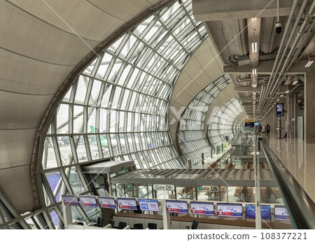 Modern architecture interior design of Metal structure and glass at Suvarnabhumi Departure Terminal. Modern architecture interior design of Metal structure and glass at Suvarnabhumi Departure Terminal. 108377221