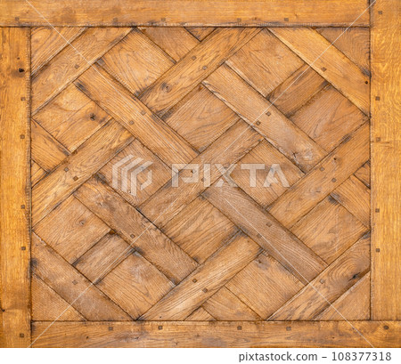 Texture and expressive wooden background made from old oak rectangular wooden planks crisscrossed. Texture and expressive wooden background made from old oak rectangular wooden planks crisscrossed. 108377318