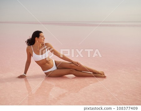 Fashion Bikini Spa Woman Relax on Pink Salt Lake, Beauty Treatment Fashion Bikini Spa Woman Relax on Pink Salt Lake, Beauty Treatment 108377409