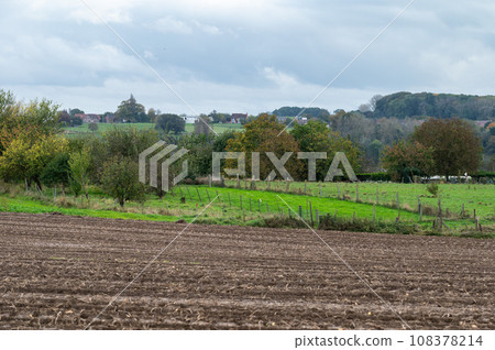 Landscape view over harvested agriculture fields of corn at the Flemish countryside around Roosdaal, Belgium Landscape view over harvested agriculture fields of corn at the Flemish countryside around Roosdaal, Belgium 108378214
