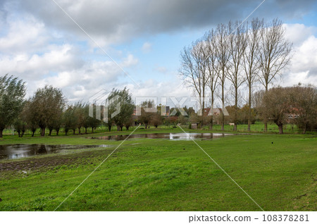Reflecting natural water ponds and trees at the Pajottenland around Lennik, Brabant, Belgium 108378281