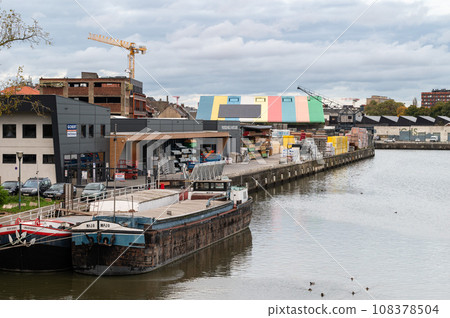 Anderlecht, Brussels Capital Region, Belgium - Bridge view over the banks of the canal with industrial activity 108378504