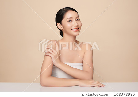Beautiful young asian woman with clean fresh skin on beige background, Face care, Facial treatment, Cosmetology, beauty and spa, Asian women portrait. Beautiful young asian woman with clean fresh skin on beige background, Face care, Facial treatment, Cosmetology, beauty and spa, Asian women portrait. 108378989