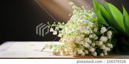 Banner with a bouquet of lilies of the valley on a wooden table, natural light and free space Banner with a bouquet of lilies of the valley on a wooden table, natural light and free space 108379326