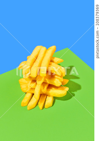 Crispy, fresh, delicious fried potato, French fries on bright green blue background. Fast food, junk food, taste. Poster Crispy, fresh, delicious fried potato, French fries on bright green blue background. Fast food, junk food, taste. Poster 108379369