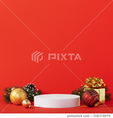 White podium and christmas decorations on red background. White podium and christmas decorations on red background. 108379979